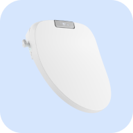 TUSHY Aura bidet toilet seat with a closed lid, on a light blue background
