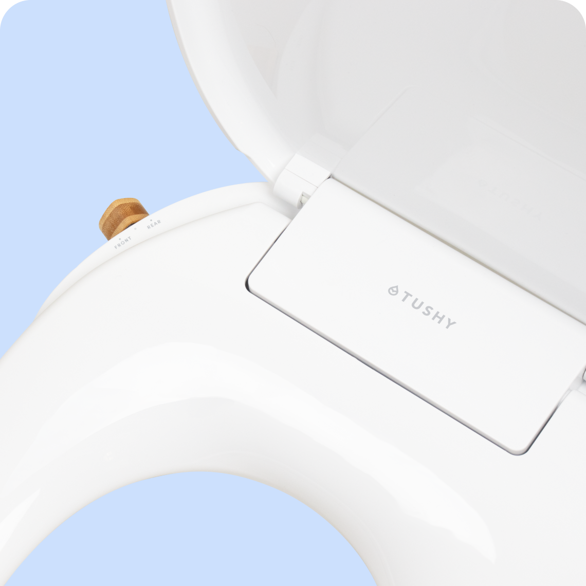 Focused photo of the Tushy Logo on a WAVE bidet toilet seat