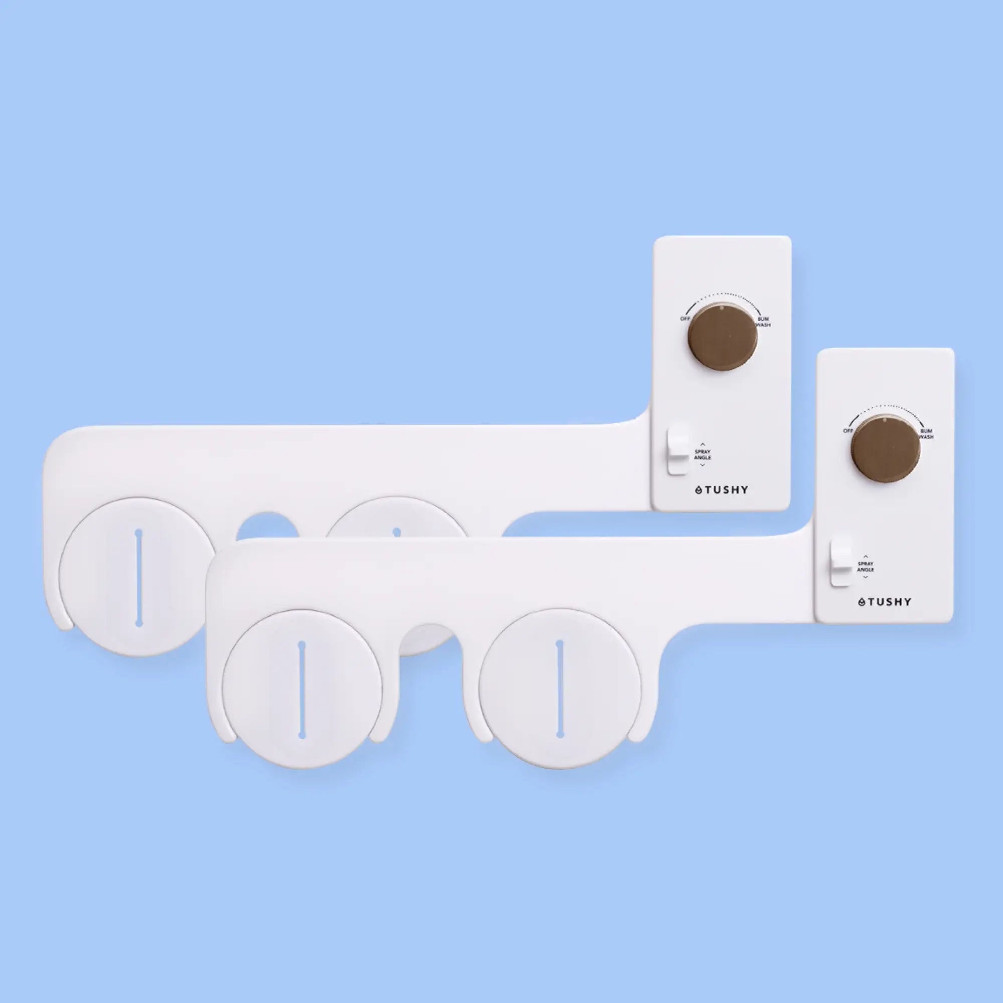 2 white TUSHY Classic bidet attachments, with bronze knobs, on a blue background