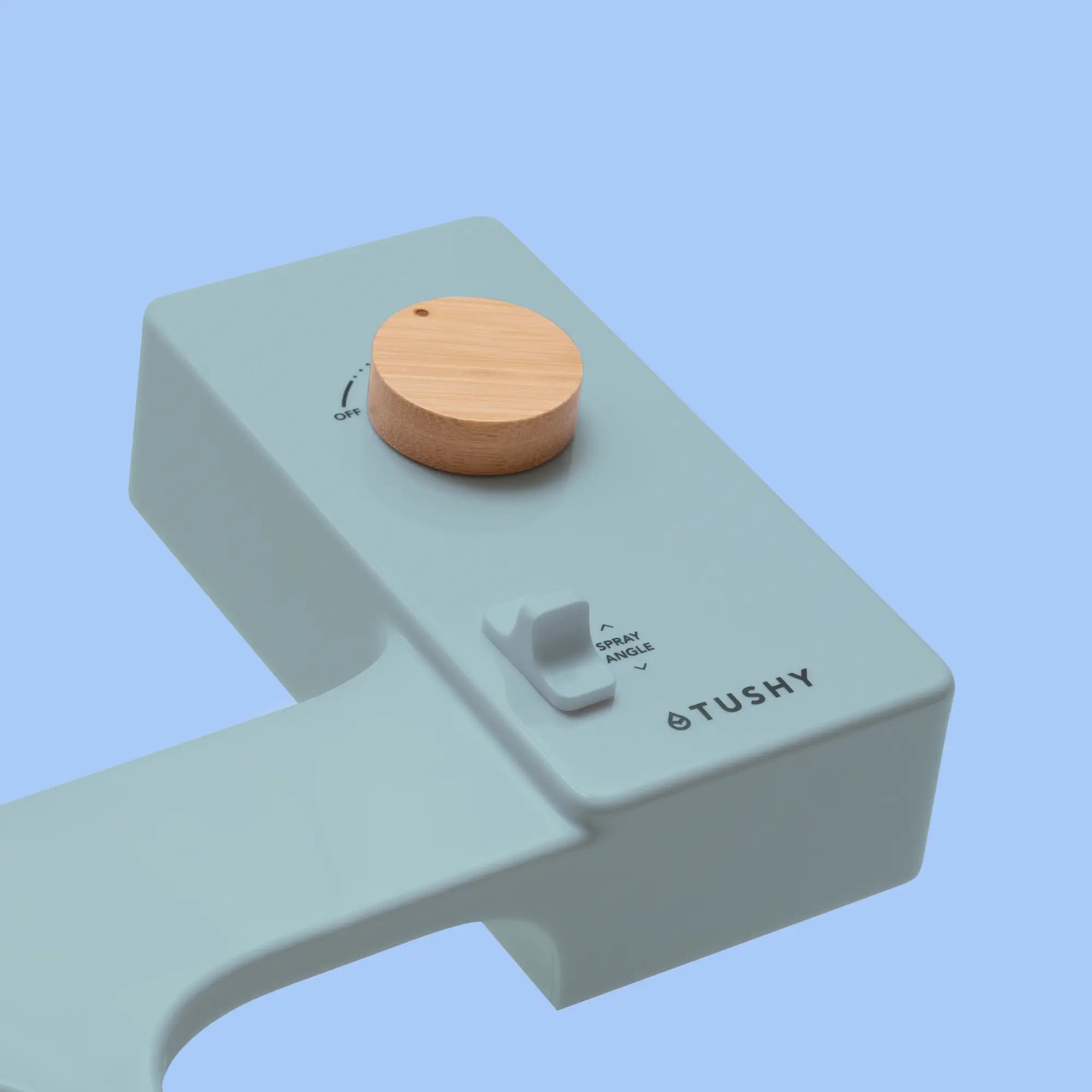 Blue TUSHY Classic console, with bamboo pressure control knob, on a light blue background
