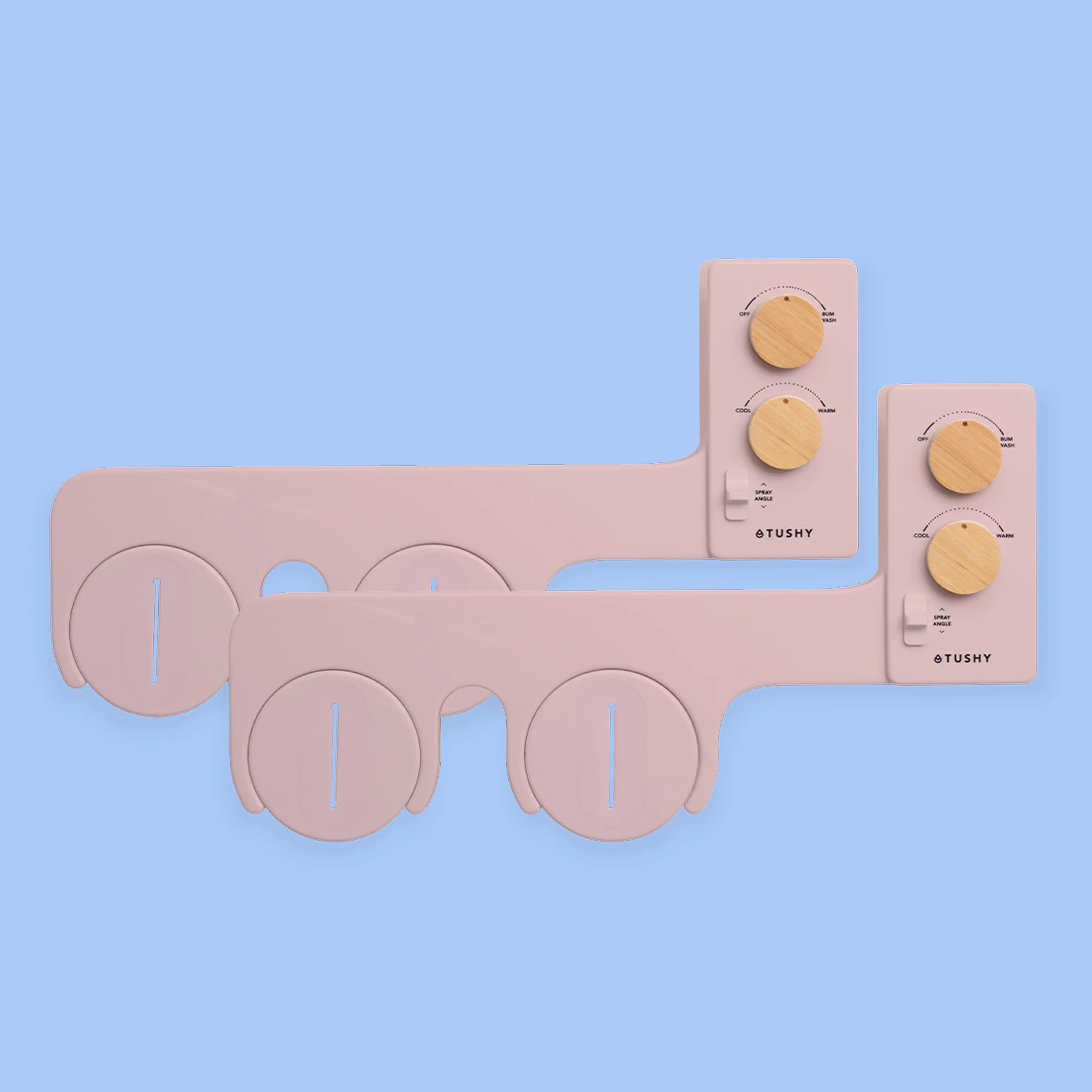 2 Pink TUSHY Spa bidet attachments, with 2 bamboo knobs, on a blue background