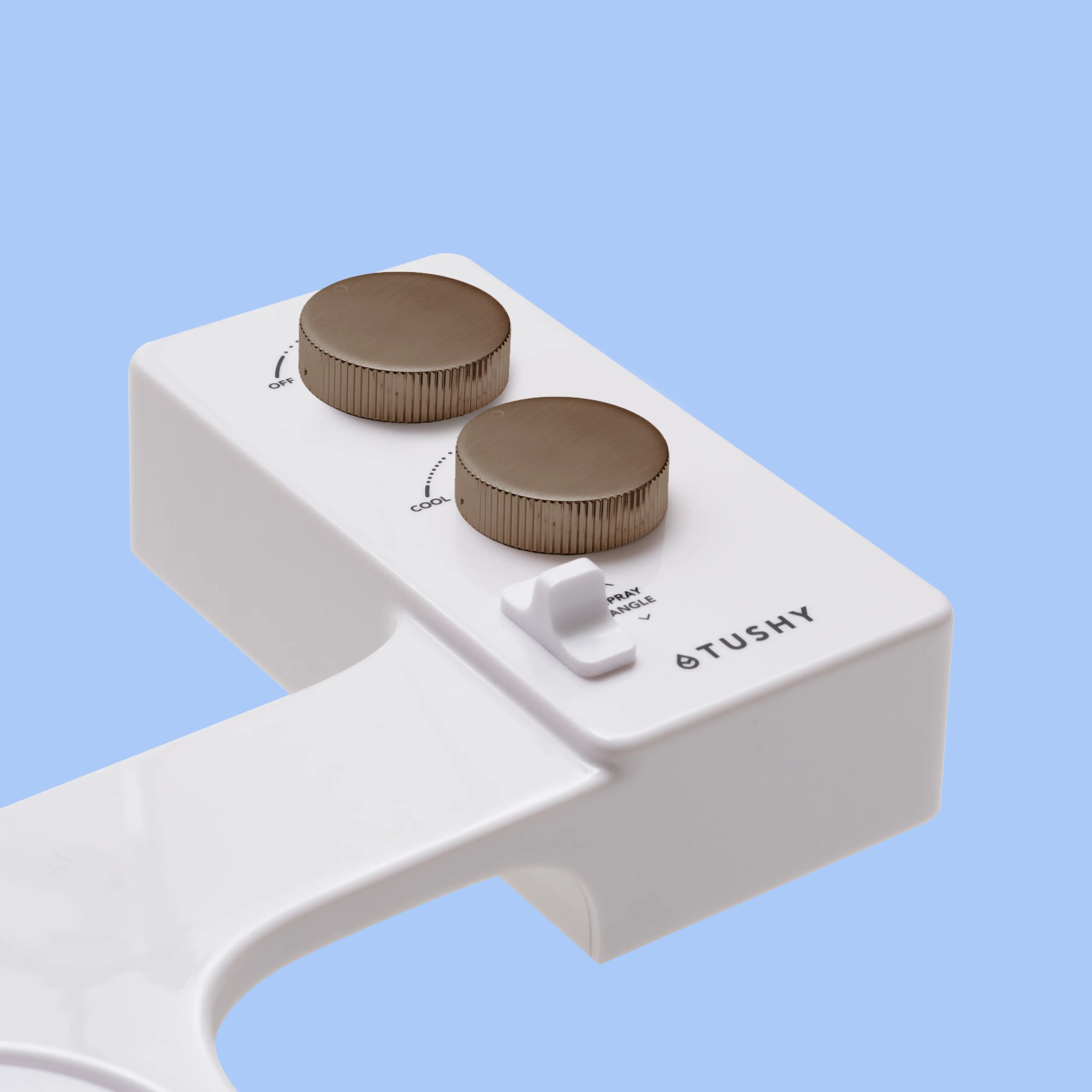 White TUSHY Spa console with 2 bronze knobs, on a blue background