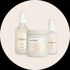 Circle featuring 3 TUSHY Late Bloomer products, room spray, candle and toilet spray