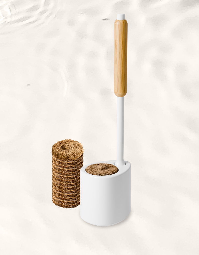 White toilet brush with a bamboo handle and a stack of coconut husk scrubbing pads, on a white background