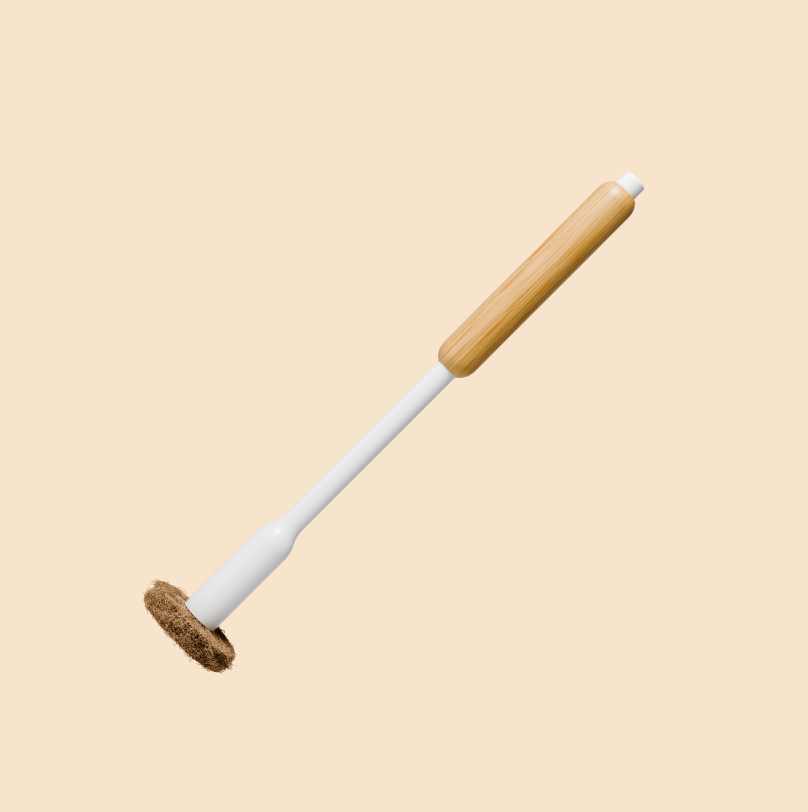 Tushy Toilet Brush with a bamboo handle and coconut husk scrubbing pad on a beige background