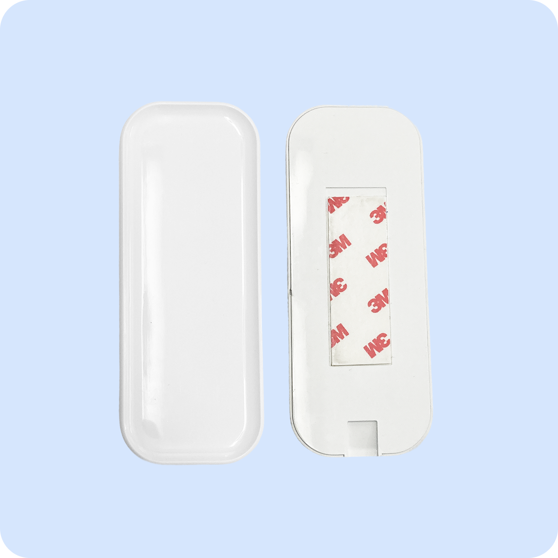White remote mounting dock with adhesive backing, designed for secure attachment.