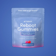 Pouch of Reboot Fiber Gummies in mixed berry flavor, containing 60 gummies, dietary supplement information visible.