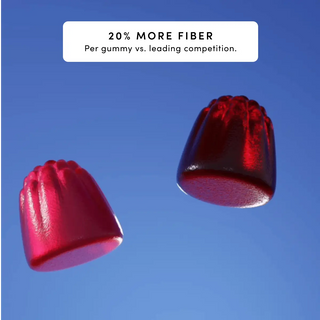 Two red gummy candies against a blue background, showcasing their texture and shape.
