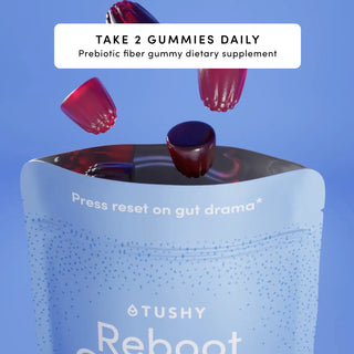 Gummy dietary supplement package with three gummies floating above it against a blue background.