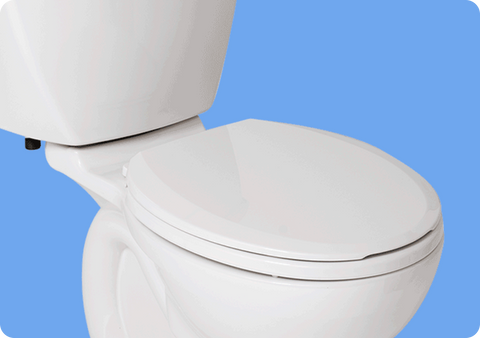 White toilet with a closed seat on a blue background