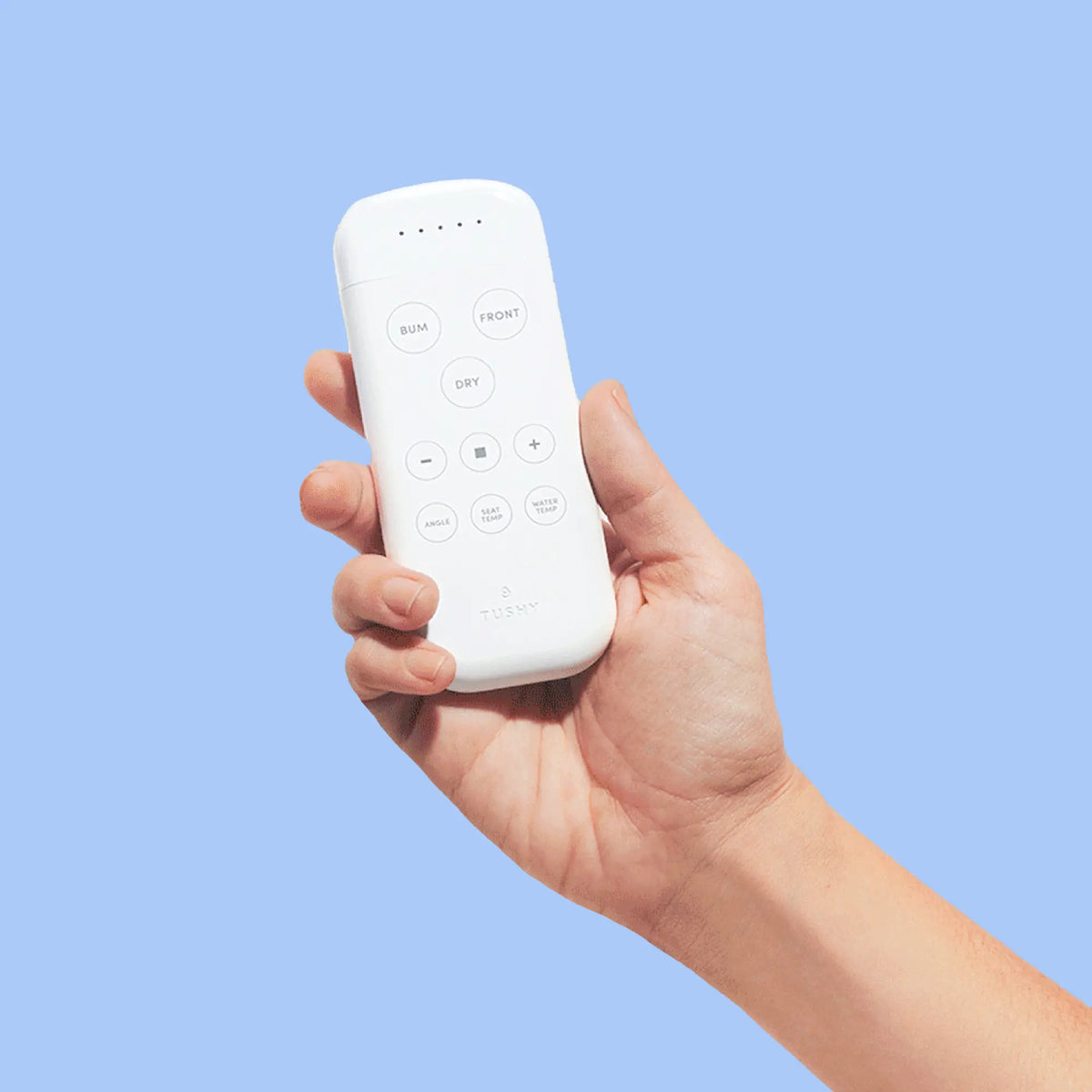 TUSHY Ace remote in a person's hand