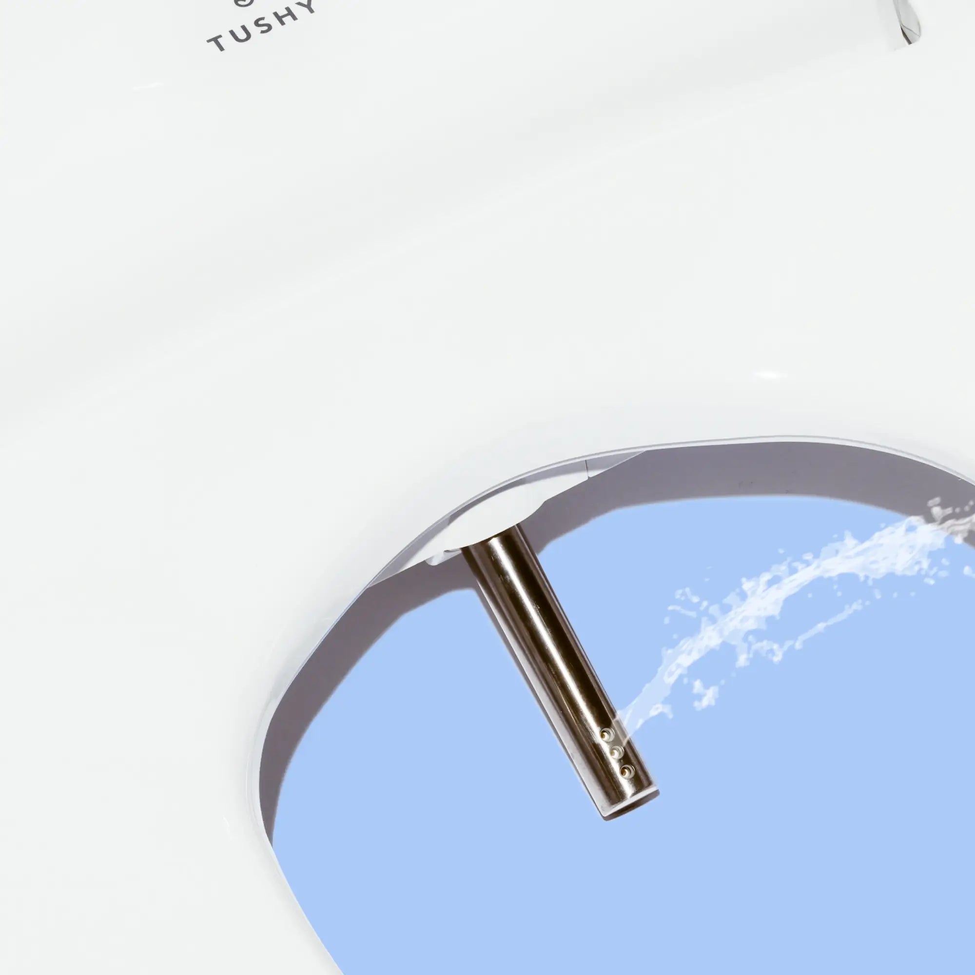 TUSHY Ace bidet nozzle spraying water