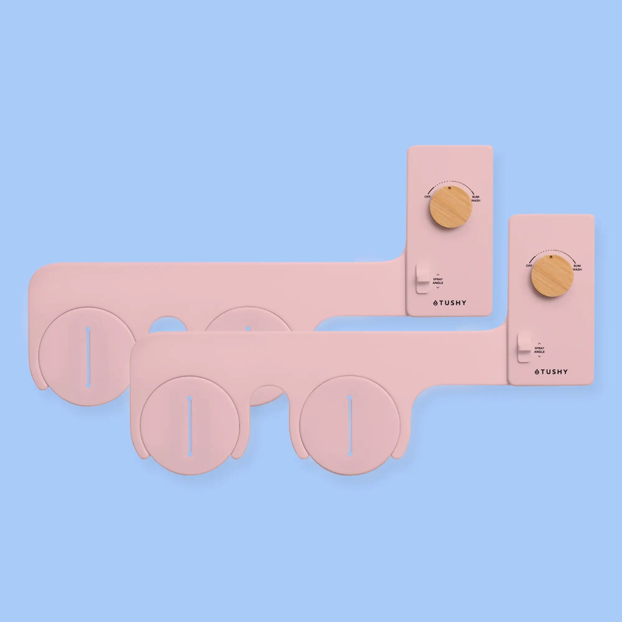 2 pack of TUSHY Classics in pink, with bamboo pressure control knobs, on a light blue background