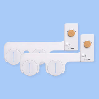 2 pack of TUSHY Classics in white, with bamboo pressure control knobs, on a light blue background
