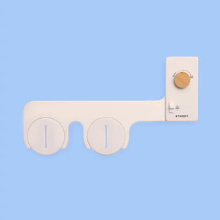 Biscuit 'TUSHY' Classic, with a bamboo pressure control knob, on a light blue background