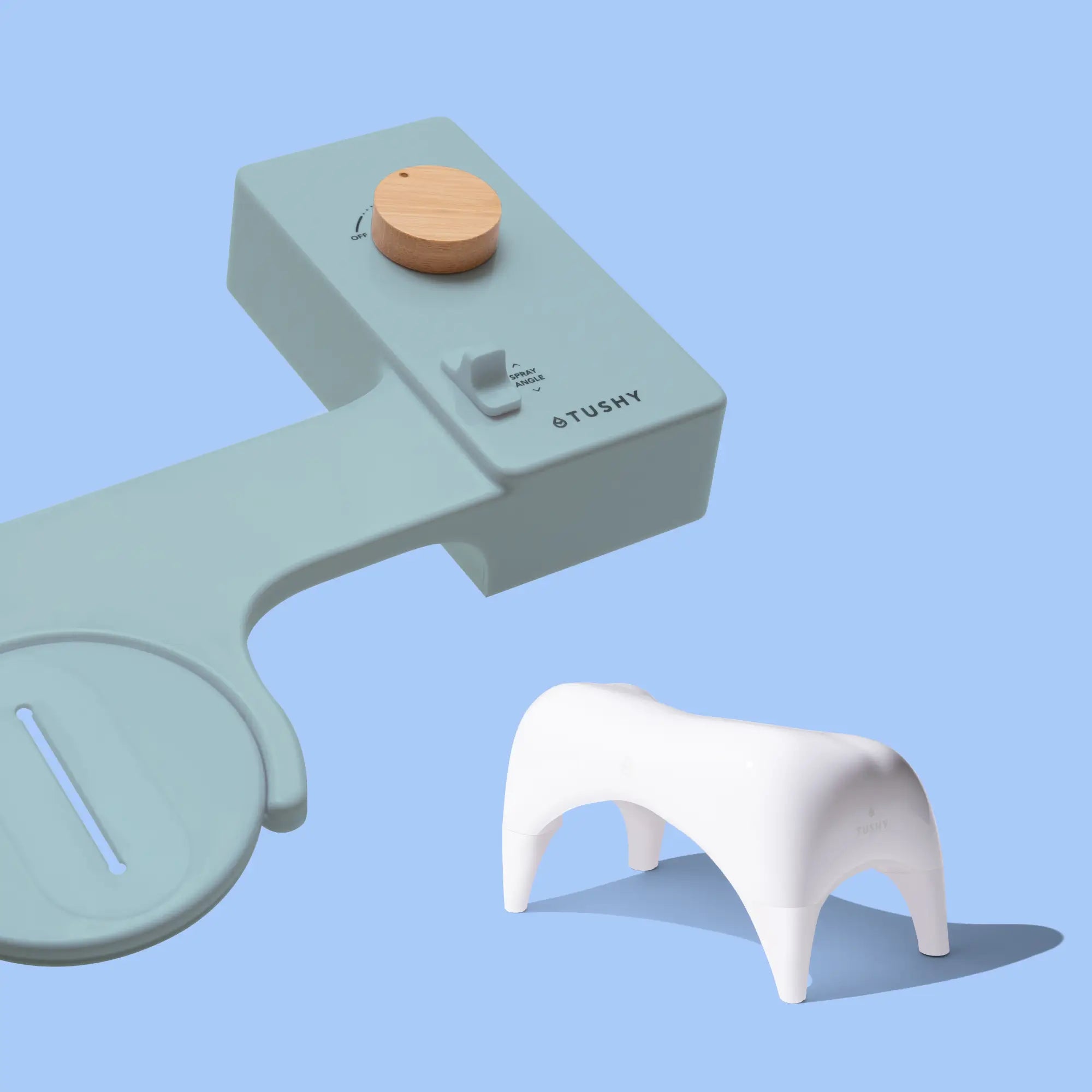 Blue 'TUSHY' Classic console, with a bamboo pressure control knob, and a white Tushy Ottoman, on a light blue background