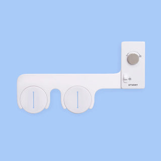 White 'TUSHY' Classic, with a platinum pressure control knob, on a light blue background