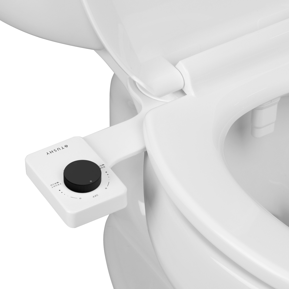 Angled view of a Tushy with a black knob, and a wide spray nozzle