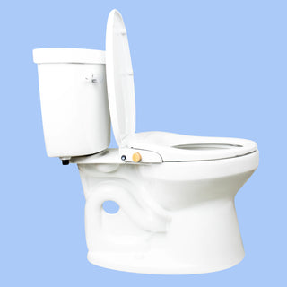 Side view of a toilet with a TUSHY Oasis bidet seat, lid open, with a bamboo control knob, on a blue background 