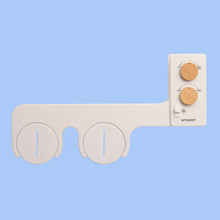 Biscuit TUSHY Spa, with 2 bamboo control knobs, on a blue background