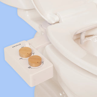 Biscuit TUSHY Spa console with 2 bamboo knobs, installed on a toilet, on a blue background
