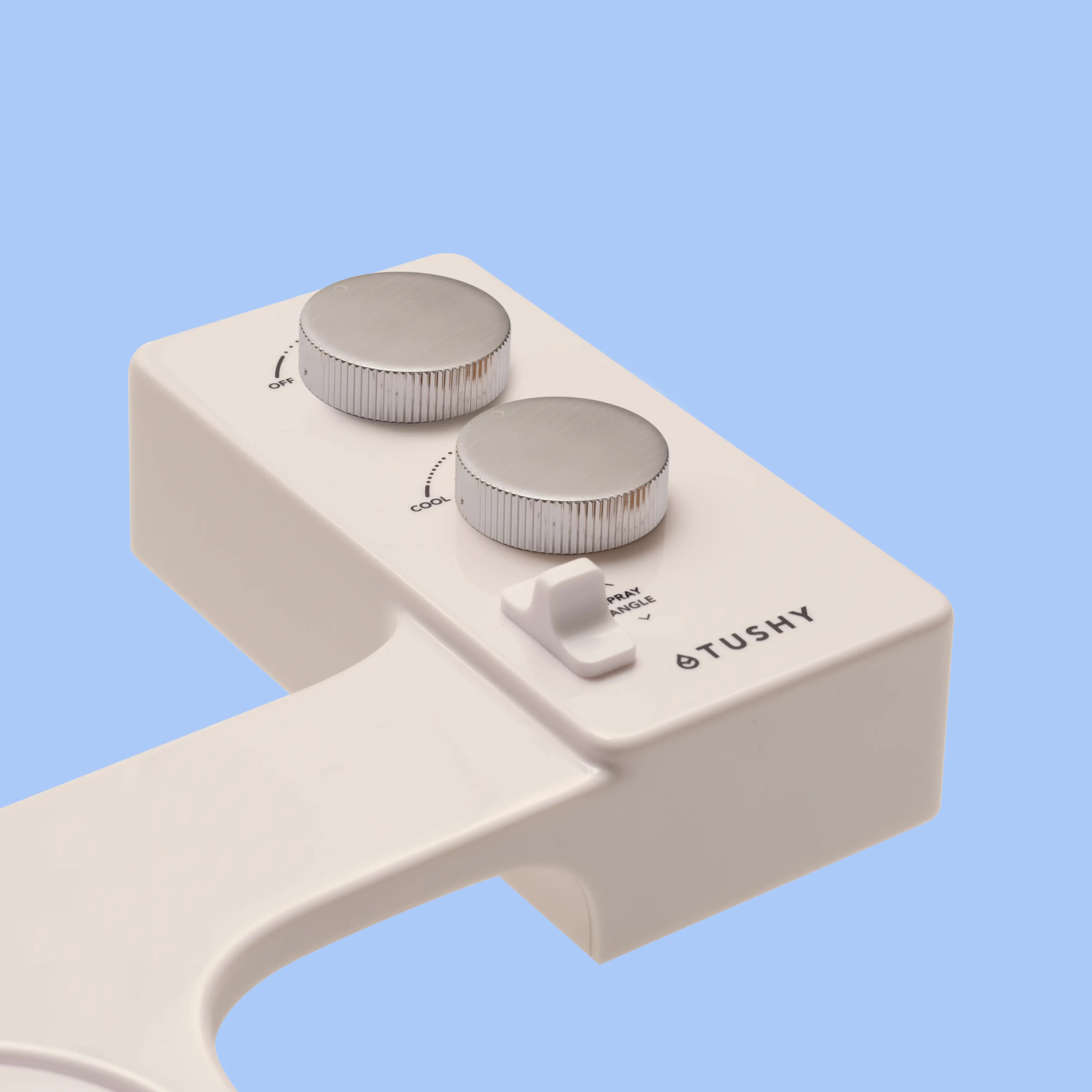 Biscuit TUSHY Spa console with 2 platinum knobs,  on a blue background