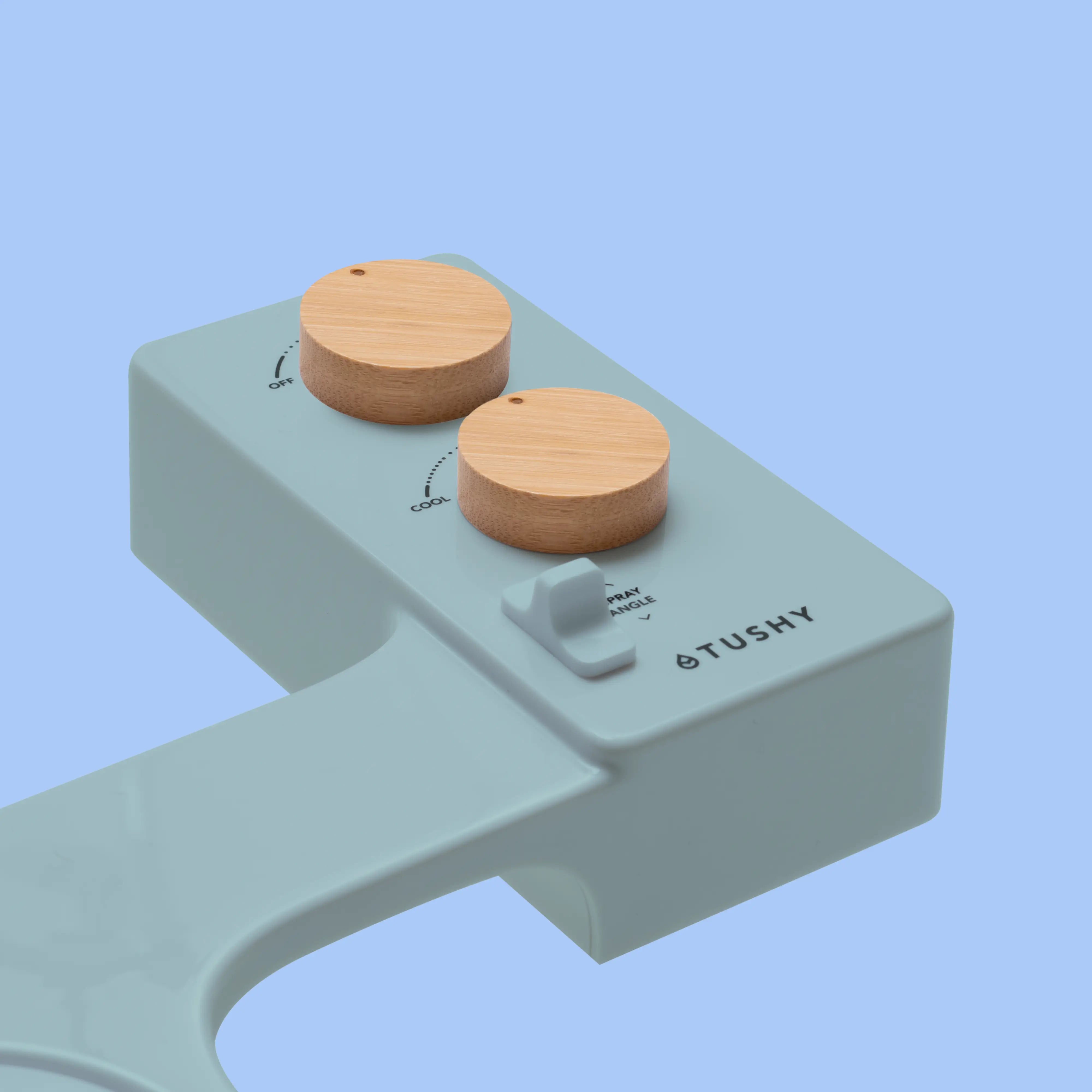 Blue TUSHY Spa console with 2 bamboo knobs, on a blue background