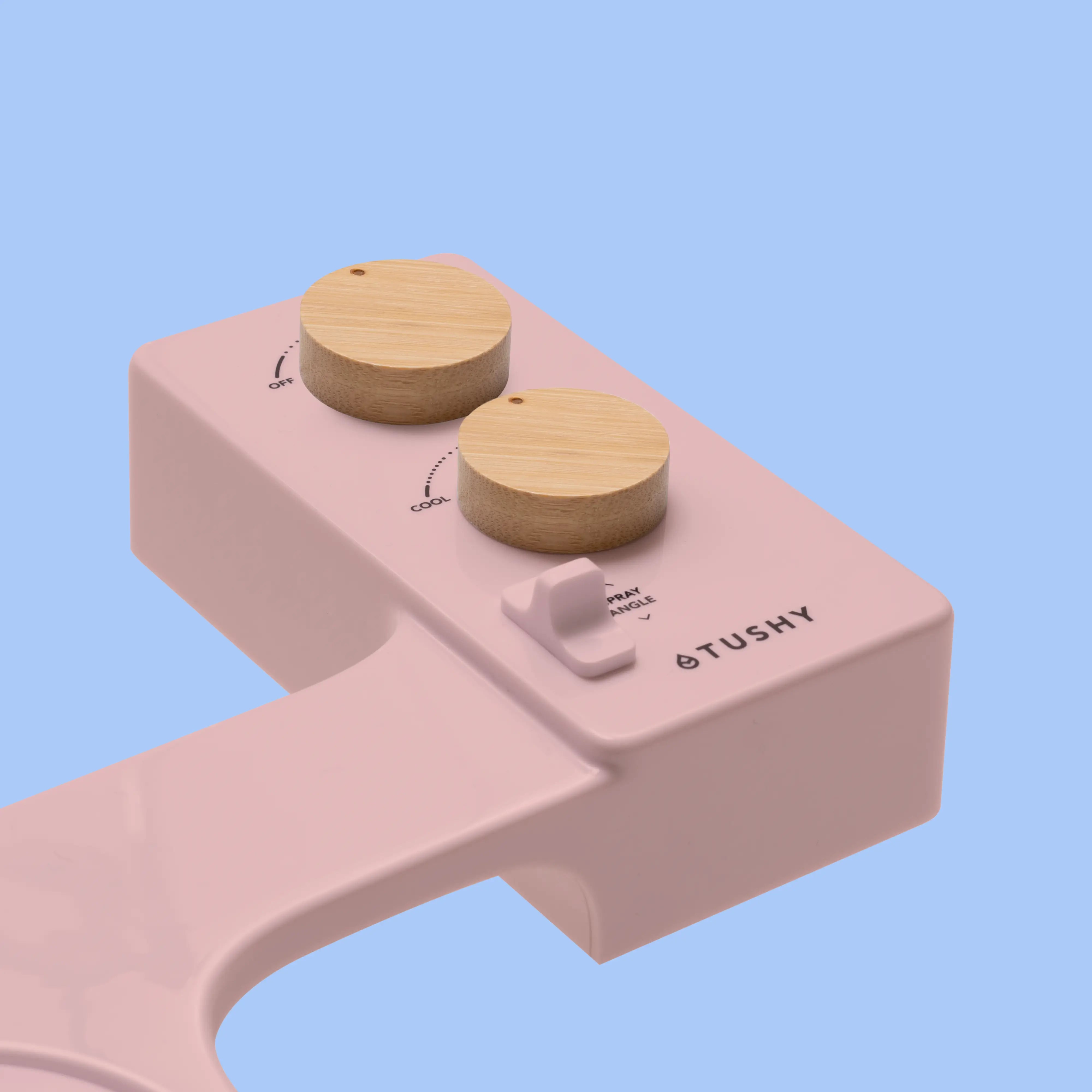 Pink TUSHY Spa console with 2 bamboo knobs, on a blue background