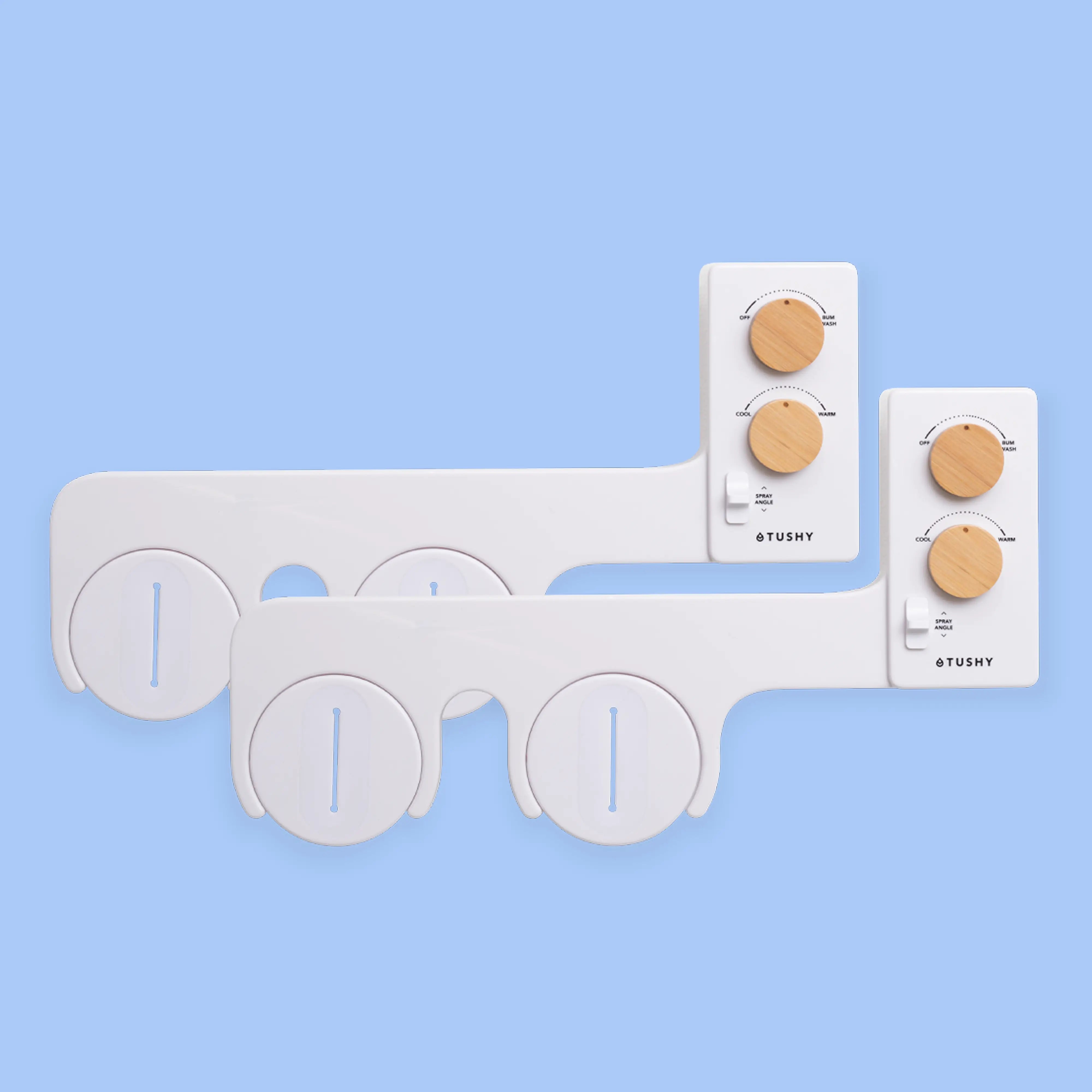 2 white TUSHY Spa bidet attachments, with 2 bamboo knobs, on a blue background
