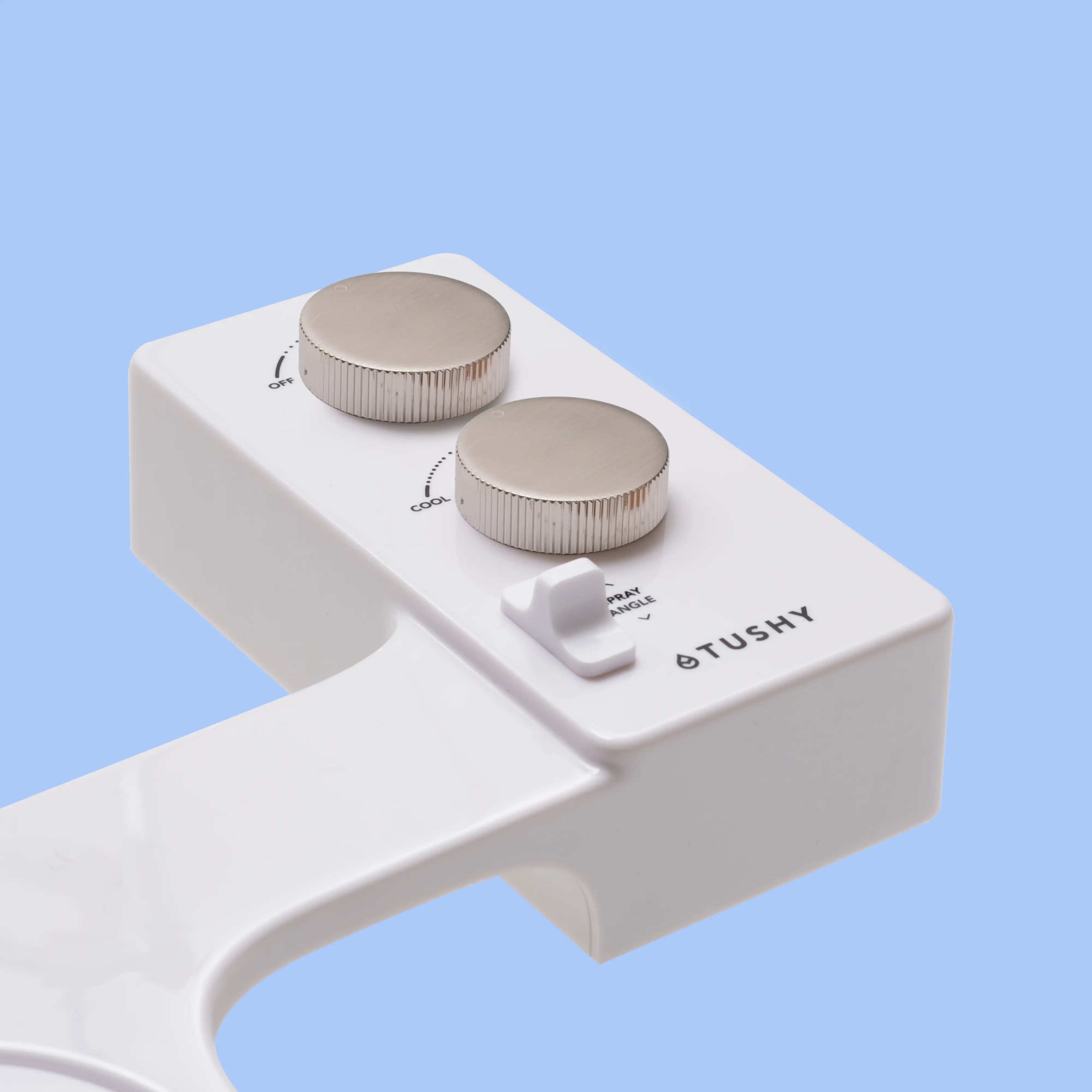 White TUSHY Spa console with 2 platinum knobs, on a blue background