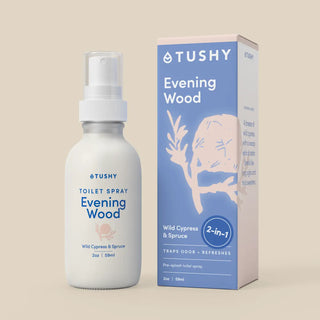 Tushy Evening Wood toilet spray bottle and packaging on a beige background