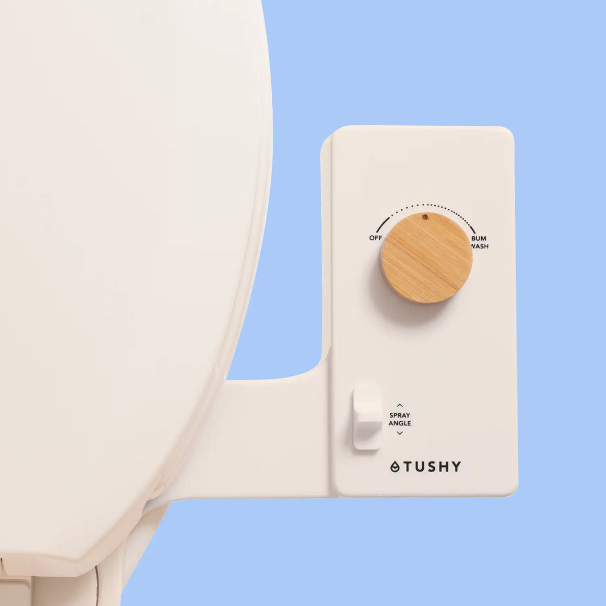 Biscuit Tushy Classic console with a bamboo knob, on a light blue background