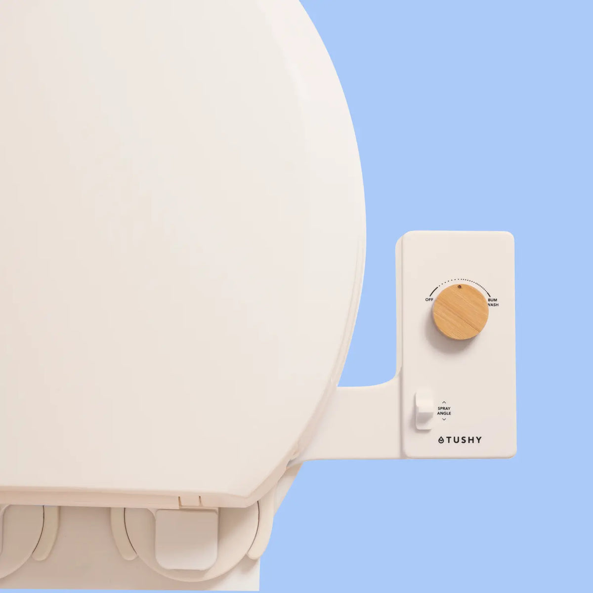 Biscuit Tushy Classic console with a bamboo knob, on a light blue background