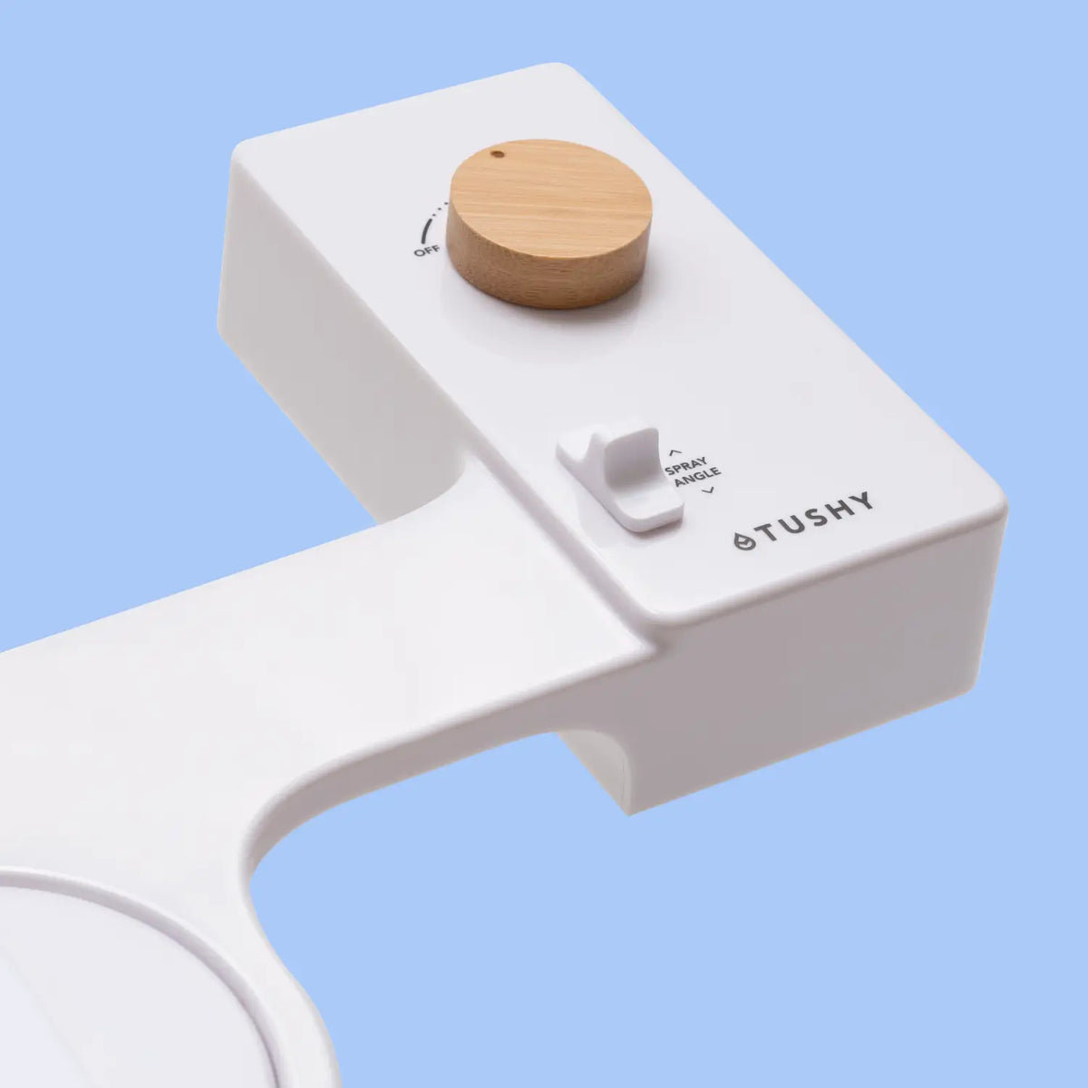 White Tushy Classic console with a bamboo knob, on a light blue background