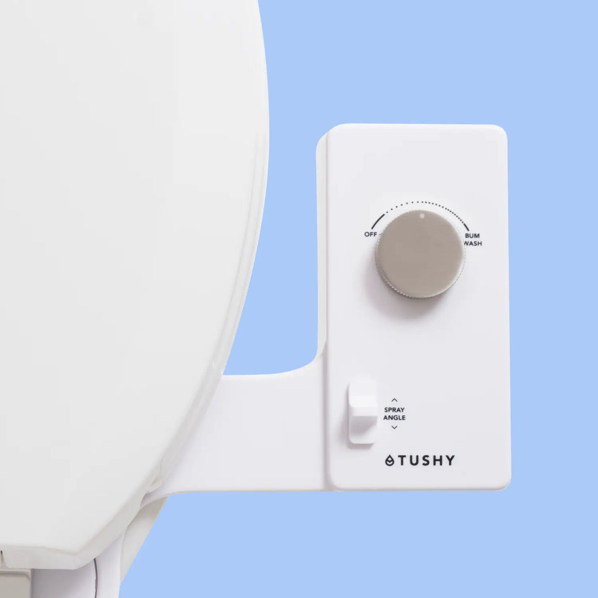 White Tushy Classic console with a platinum knob, on a light blue background