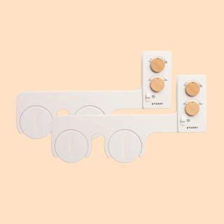 Bidet attachment with two control panels and circular water outlets for adjustable settings.