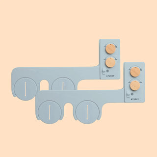 Gray bidet attachment with wooden knobs for water pressure and temperature control.