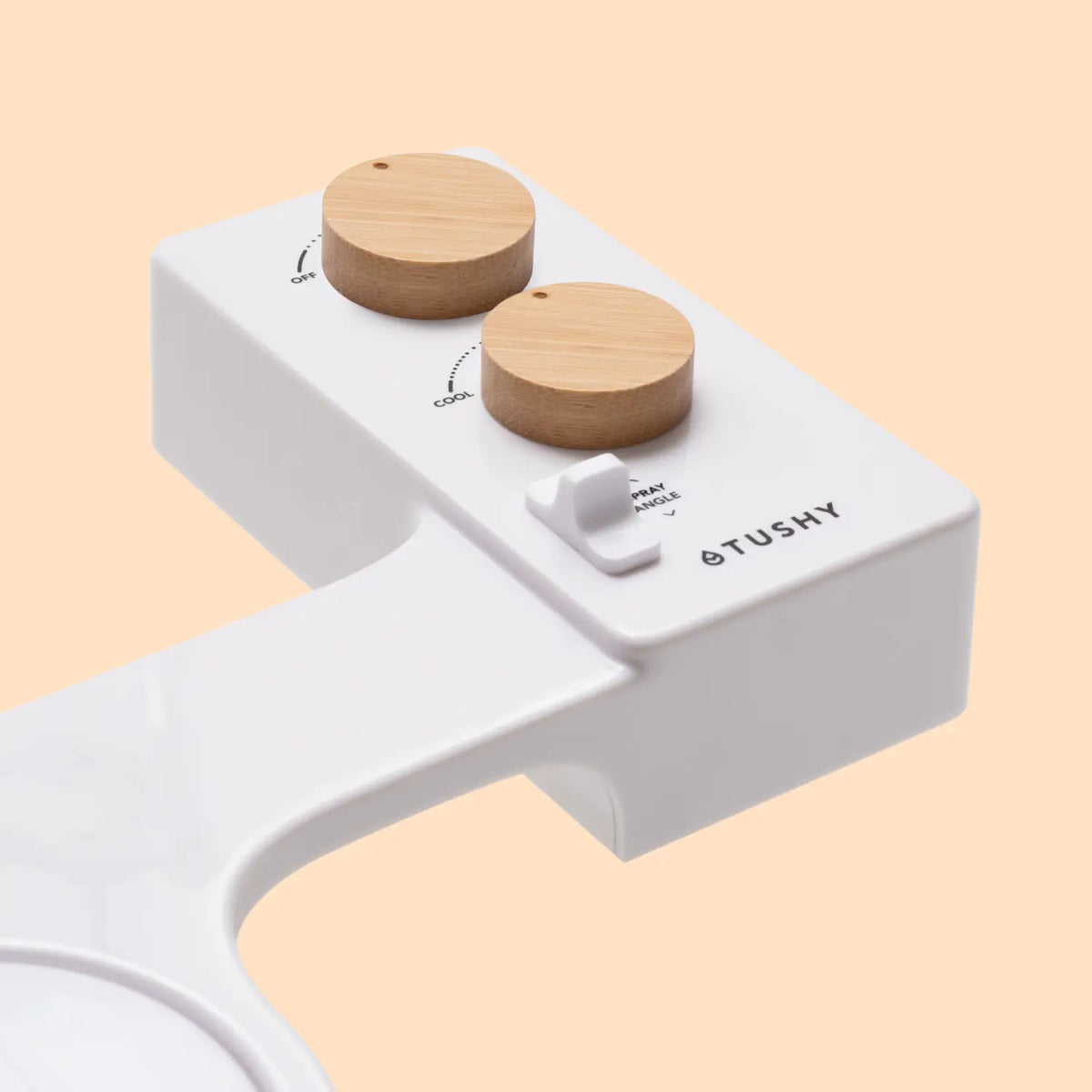 Control panel of a bidet attachment featuring two wooden knobs and a spray angle adjustment switch.
