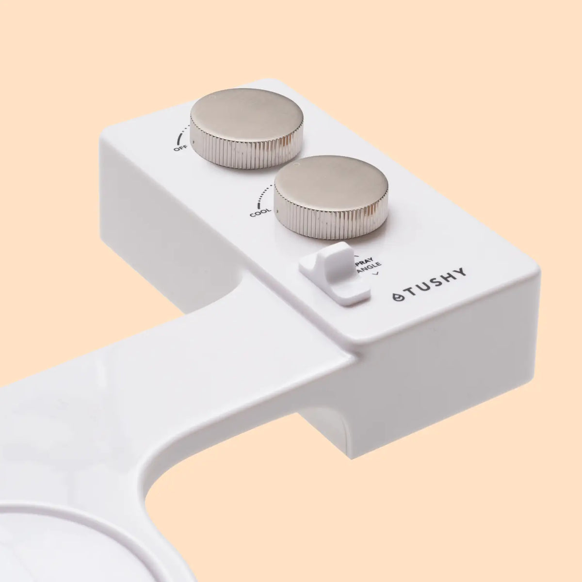 White bidet attachment with two silver knobs for water temperature and spray angle adjustment.