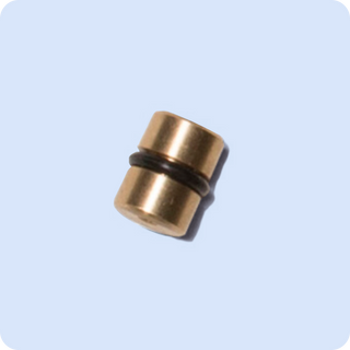 Brass pressure reduction insert with a black rubber O-ring.