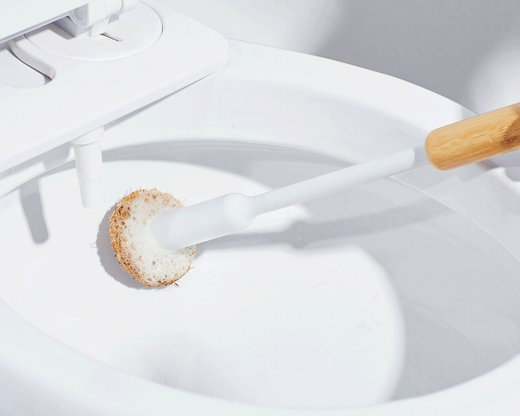 Animation of a Tushy toilet brush scrubbing the inside of a toilet