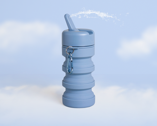 Collapsible blue travel bottle with a spout and a carabiner attached.
