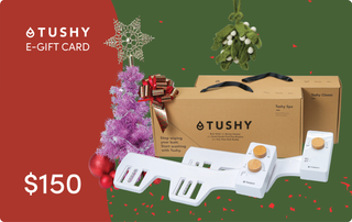 E-gift card for TUSHY products, featuring a white bidet attachment and a brown box labeled "Tushy Spa" and "Tushy Classic."