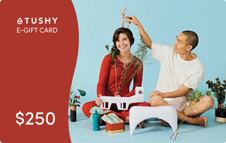 E-gift card design featuring a $250 value, with a red background and two people surrounded by plants and decorative items.